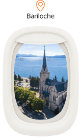 Imagem ilustrativa janela de avião com imagem de Bariloche